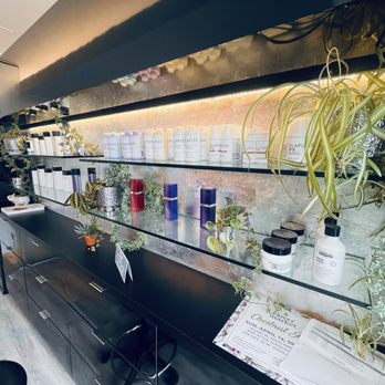 Backlit shelves of curated hair care products